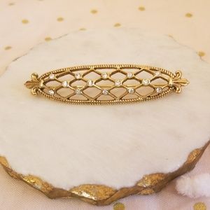 Gold lattice brooch